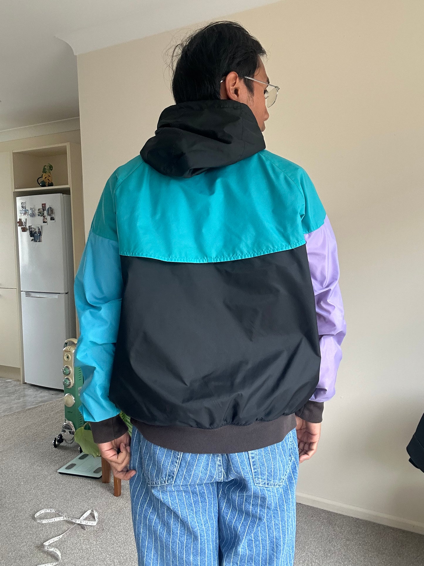 Nike Sportswear Windrunner Jacket in a black, teal, and purple colorway Large