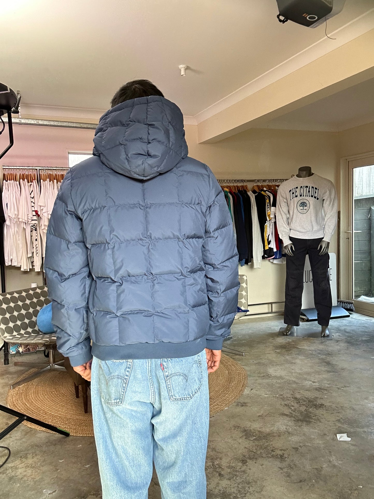 Pertex blue puffer jacket with a red inner lining and red zippers, produced by Levi's Small