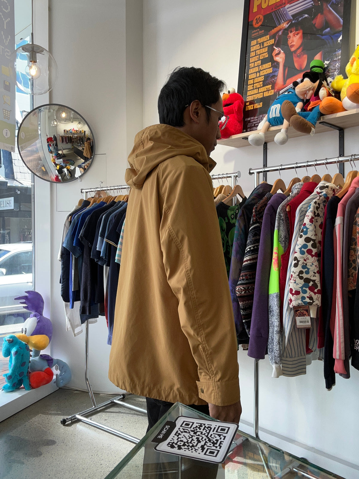Uniqlo mustard yellow oversized hooded parka featuring large utility flap pockets on the front
