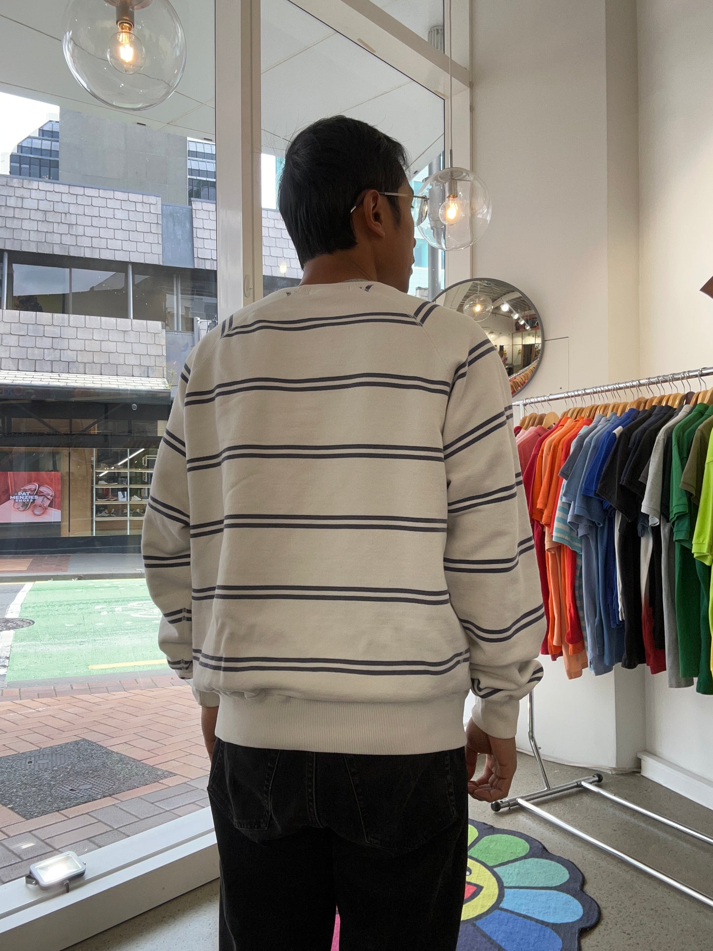 Vintage Polo Ralph Lauren striped crew neck sweater features a white base with navy horizontal stripes and an embroidered crest on the chest.