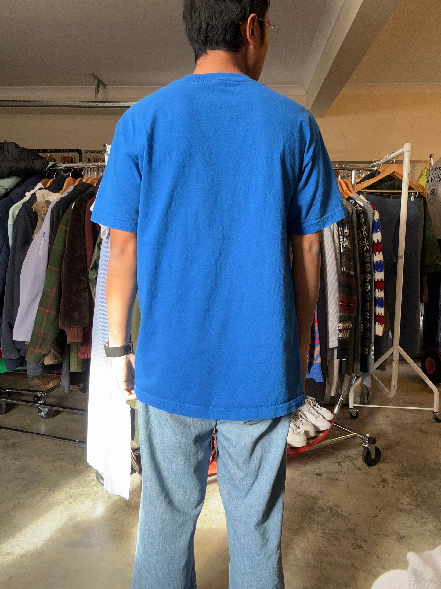 Large blue Sonic the Hedgehog t-shirt features a large graphic of Sonic's face on the front
