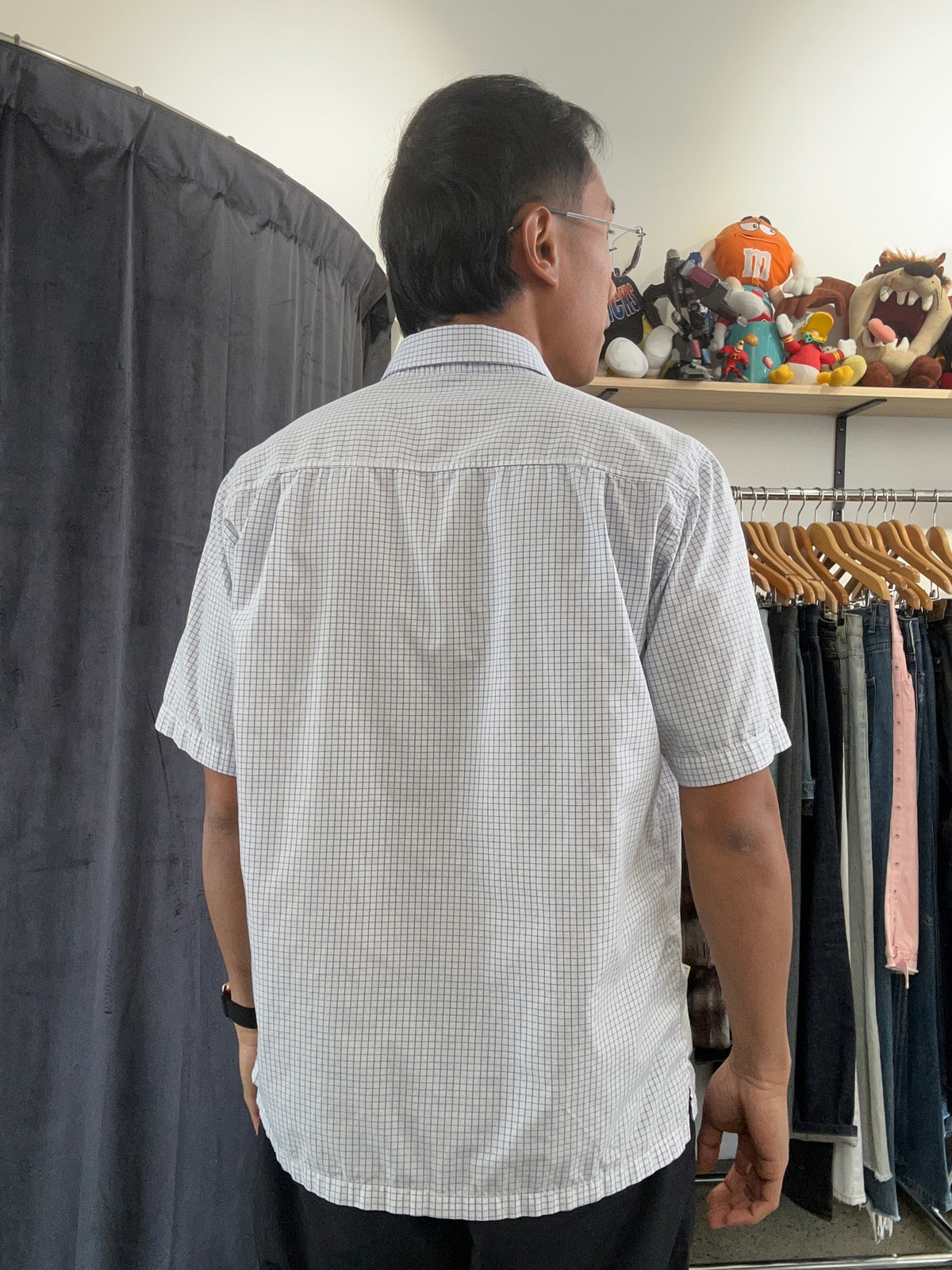 Vintage light blue and white grid-check (graph-check) short-sleeve button-down shirt by Polo Jeans Co. / Ralph Lauren featuring a small dark pony logo embroidered on the chest pocket.