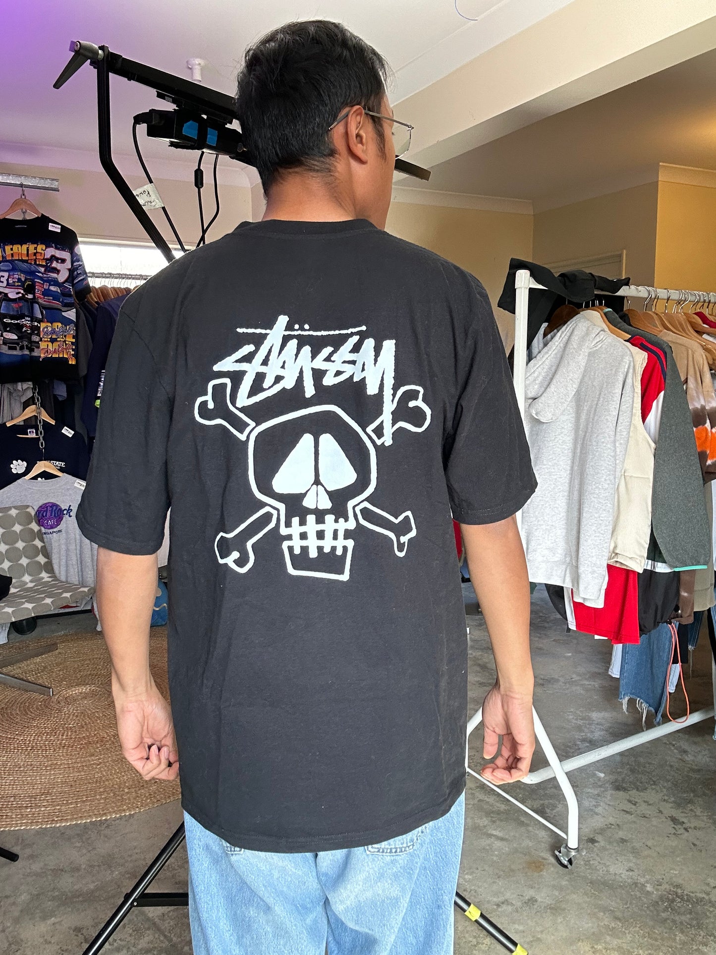 Stüssy Skull & Bones Pigment Dyed T-shirt in black, featuring a screen-printed graphic on the back XL