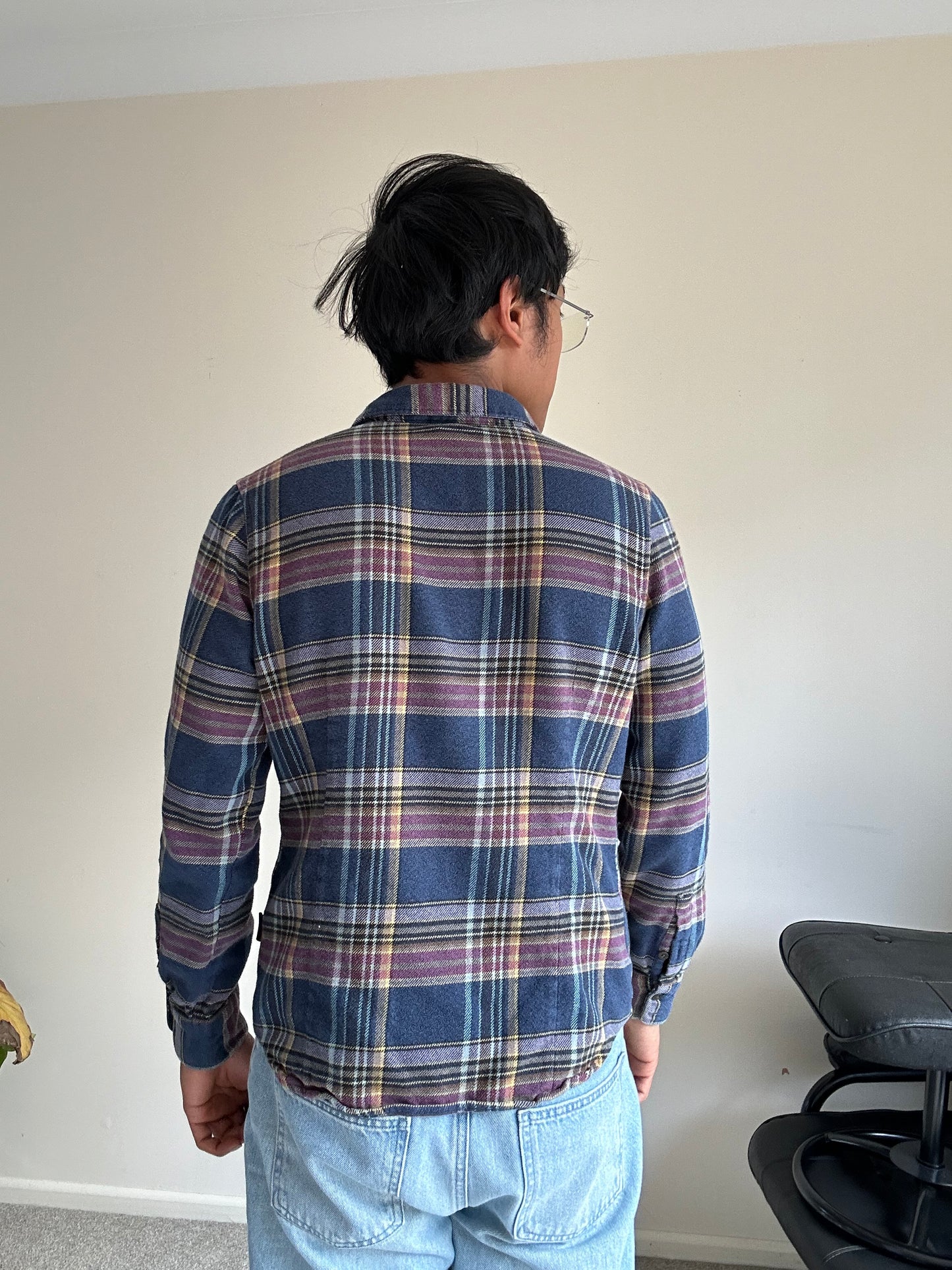 Patagonia Women's Long-Sleeved Fjord Flannel Shirt in a blue and purple plaid pattern, made from 100% organic cotton