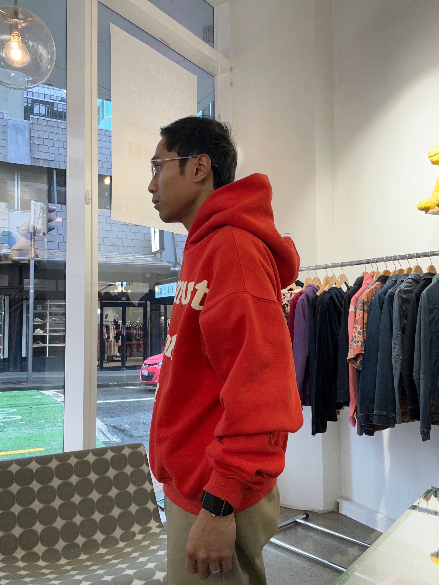 red Cactus Plant Flea Market (CPFM) "Ye Must Be Born Again" hoodie featuring prominent white puff-print lettering across the chest. Medium