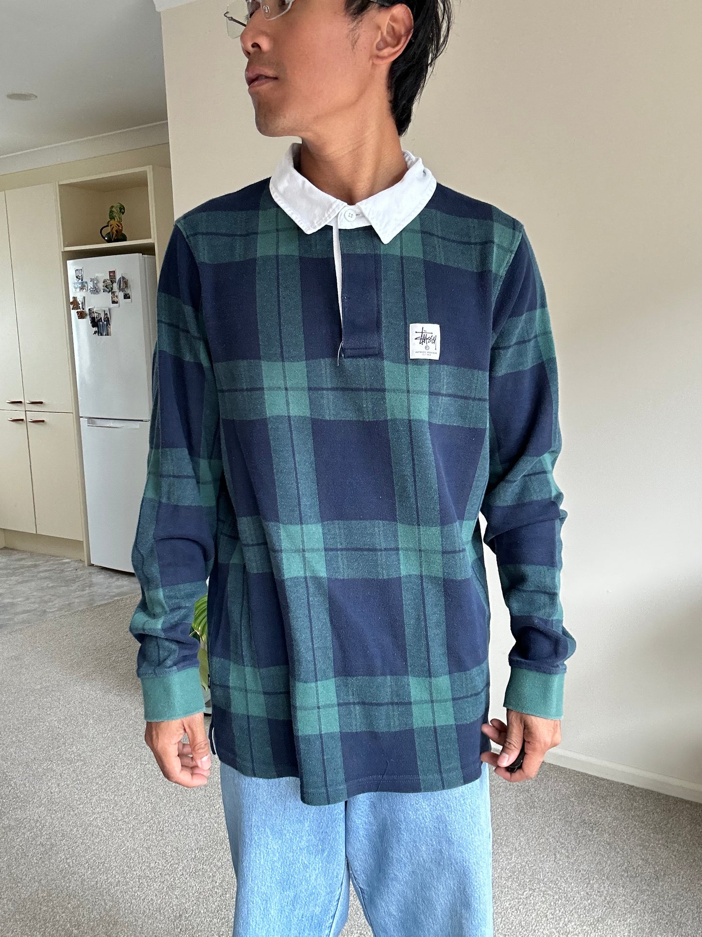 green and navy plaid shirt is the Stussy June Jacquard Rugby Shirt XL
