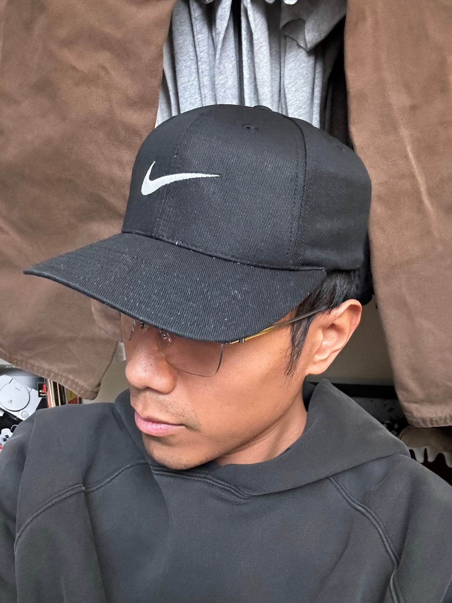 Vintage black Nike baseball cap featuring a white embroidered Swoosh Cotton