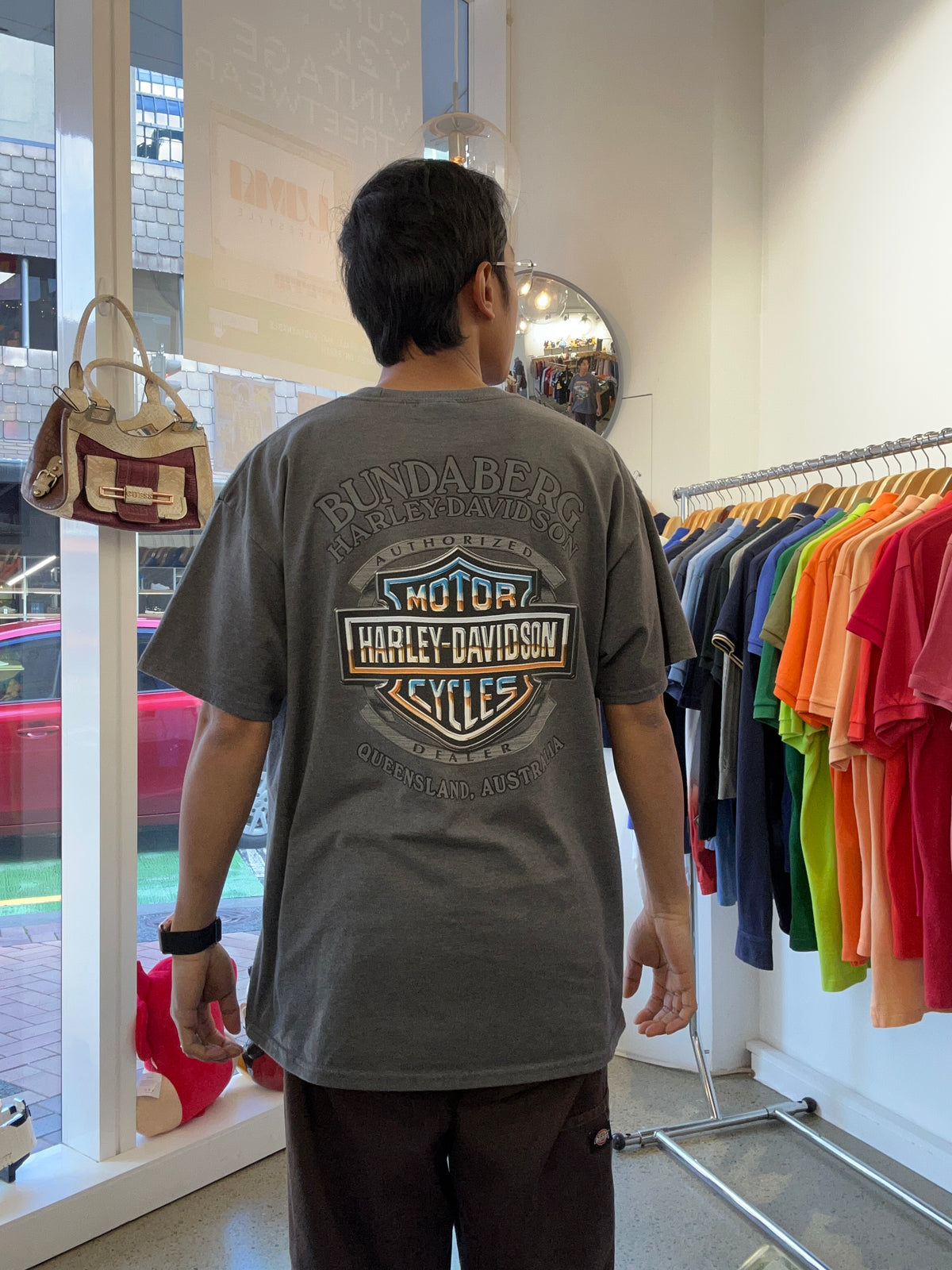vintage 1990s Harley-Davidson "Ride Australia" graphic t-shirt in a grey or charcoal wash.Queensland 2003