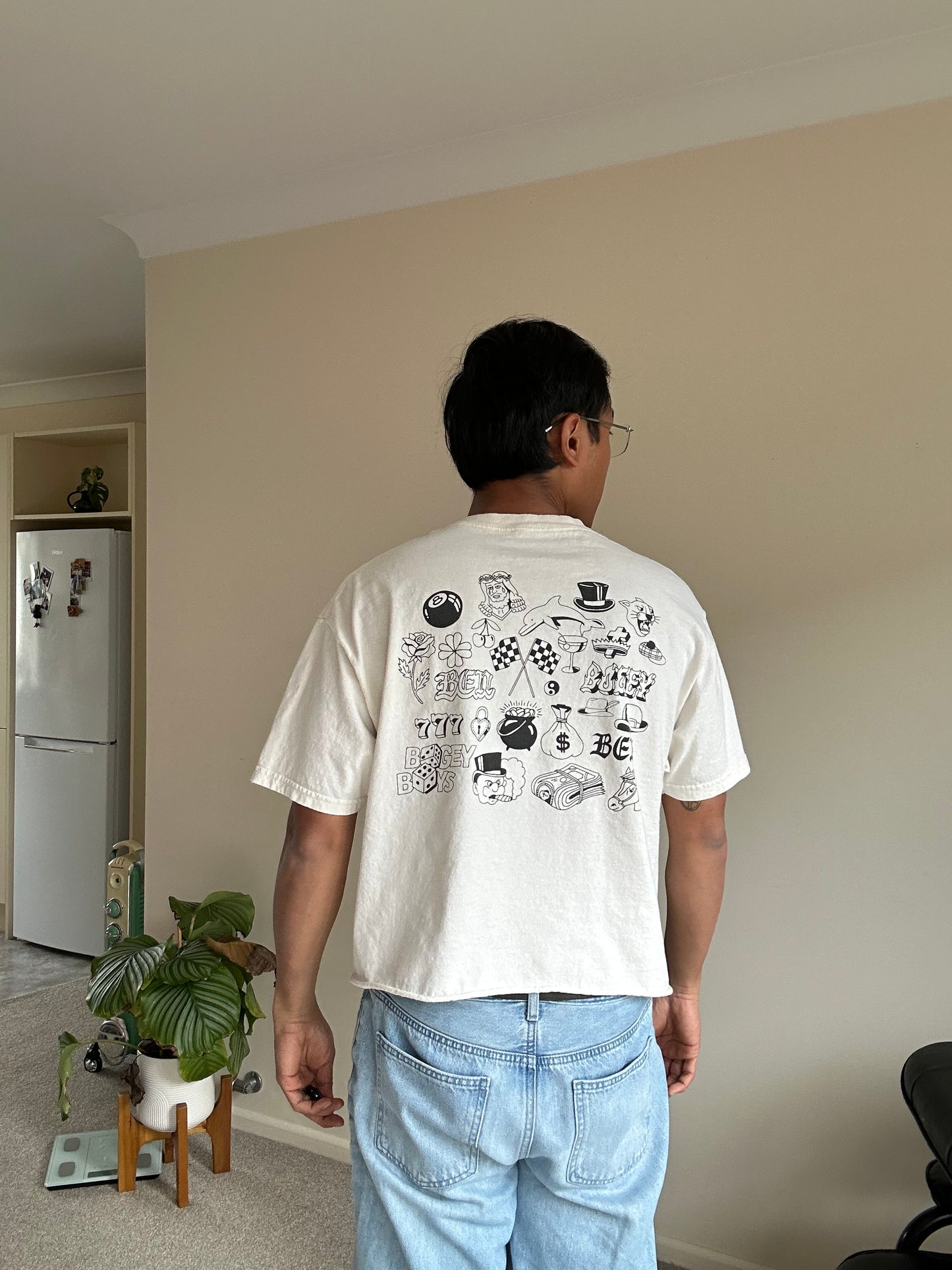 Cream cropped t-shirt with "BEN" printed in black on the chest and neckline Large