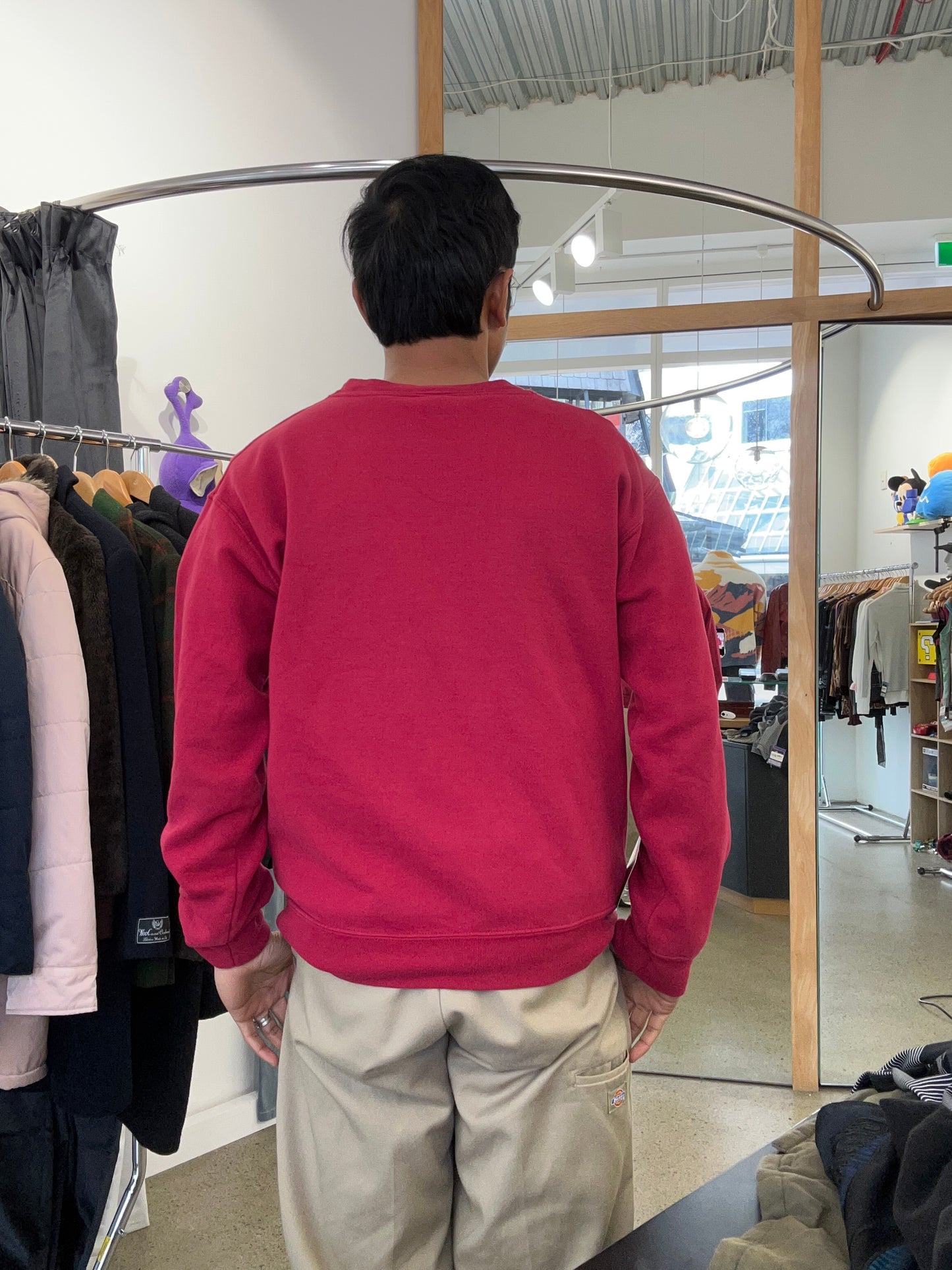 Vintage red crewneck sweatshirt features an Iowa State University graphic with the mascot Cy Medium