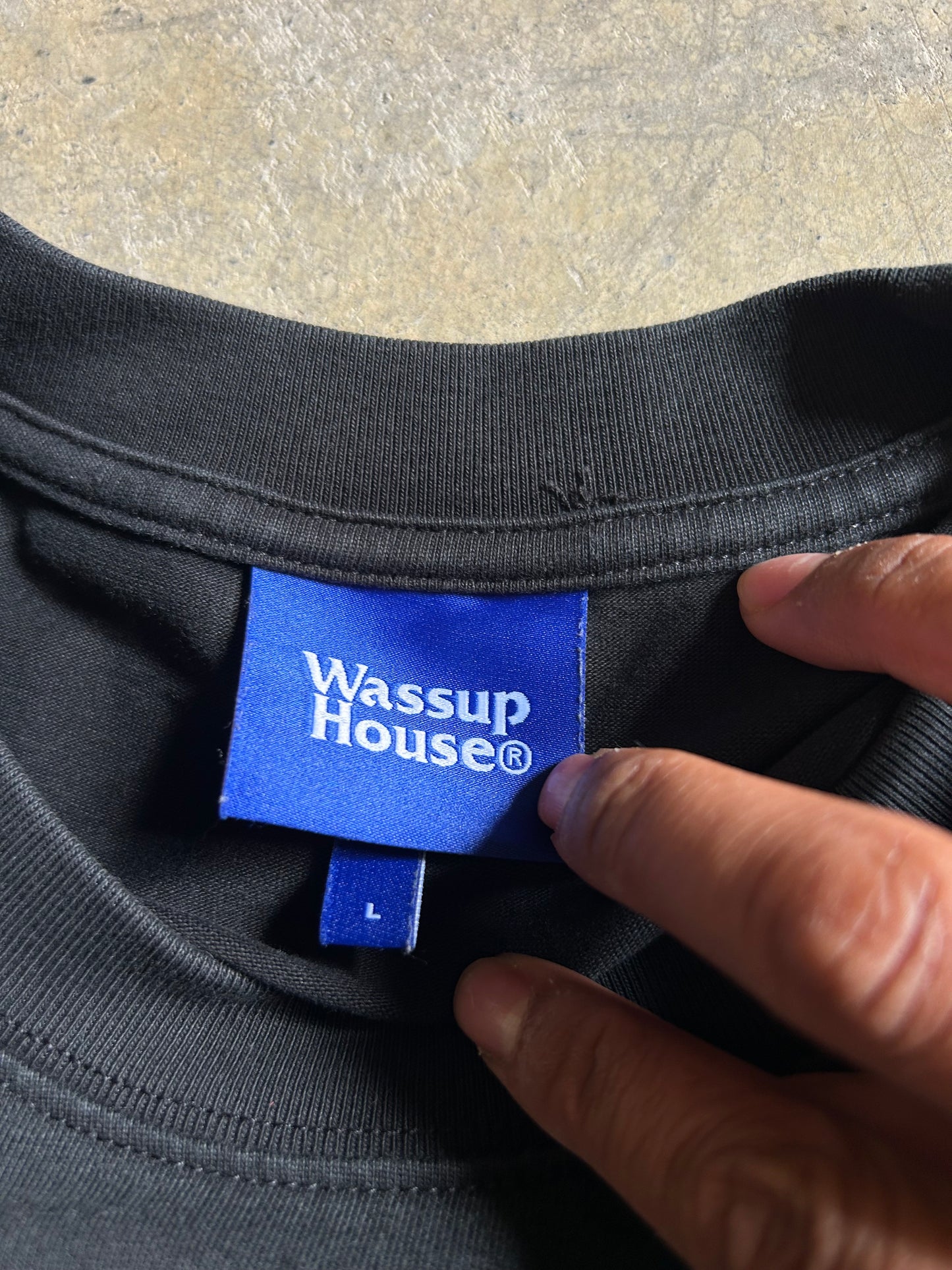 Wassup House, as indicated by the distinct "WH" logo on the chest Large Black