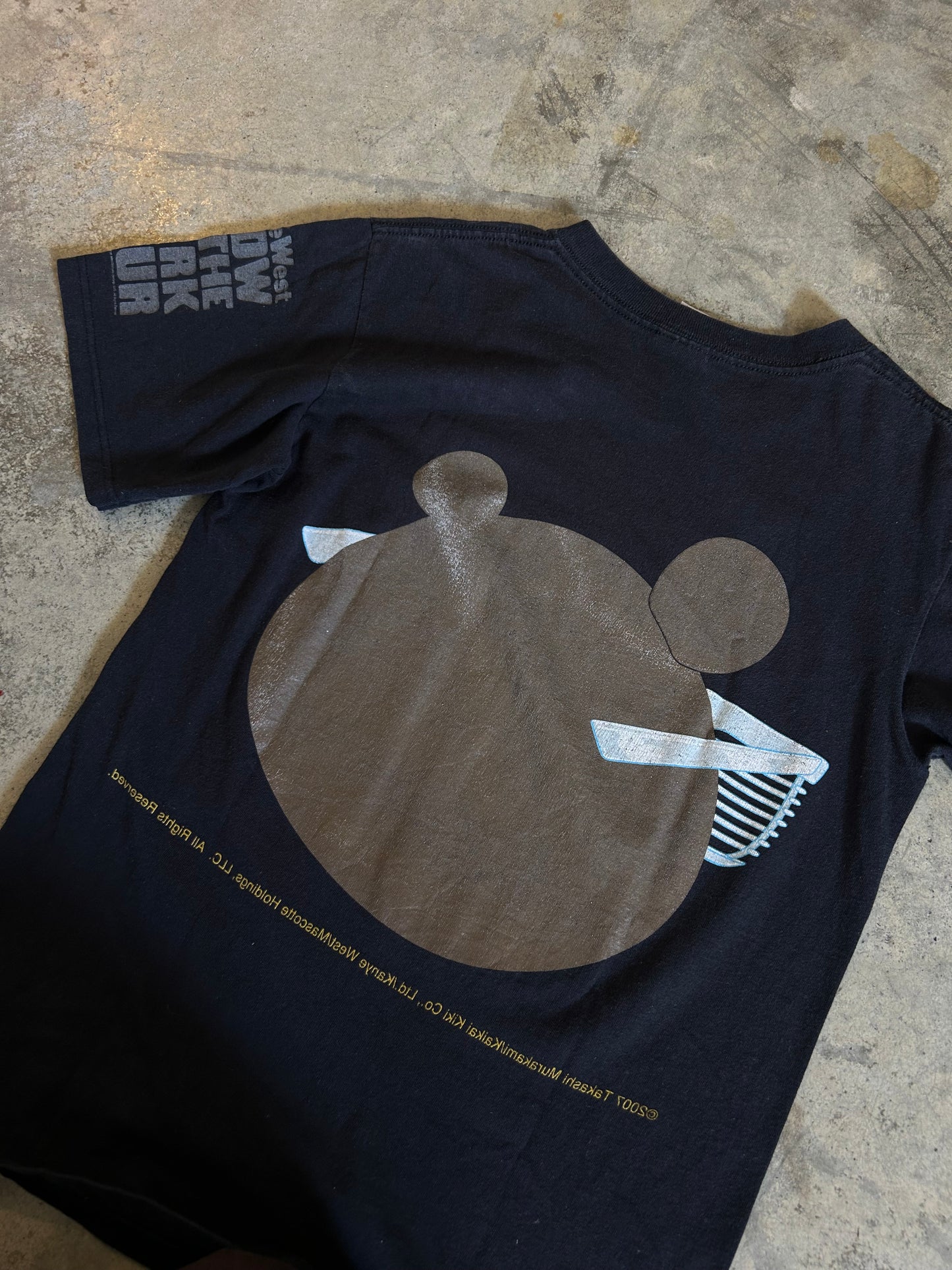 black Anvil Tag t-shirt 2007 vintage item from Kanye West's Glow in the Dark Tour, featuring the iconic Graduation bear graphic designed by Takashi Murakami Small