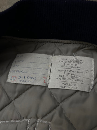 Vintage blue satin varsity bomber jacket features "Decatur Illinois" embroidered on the back in a light blue and white block font Large