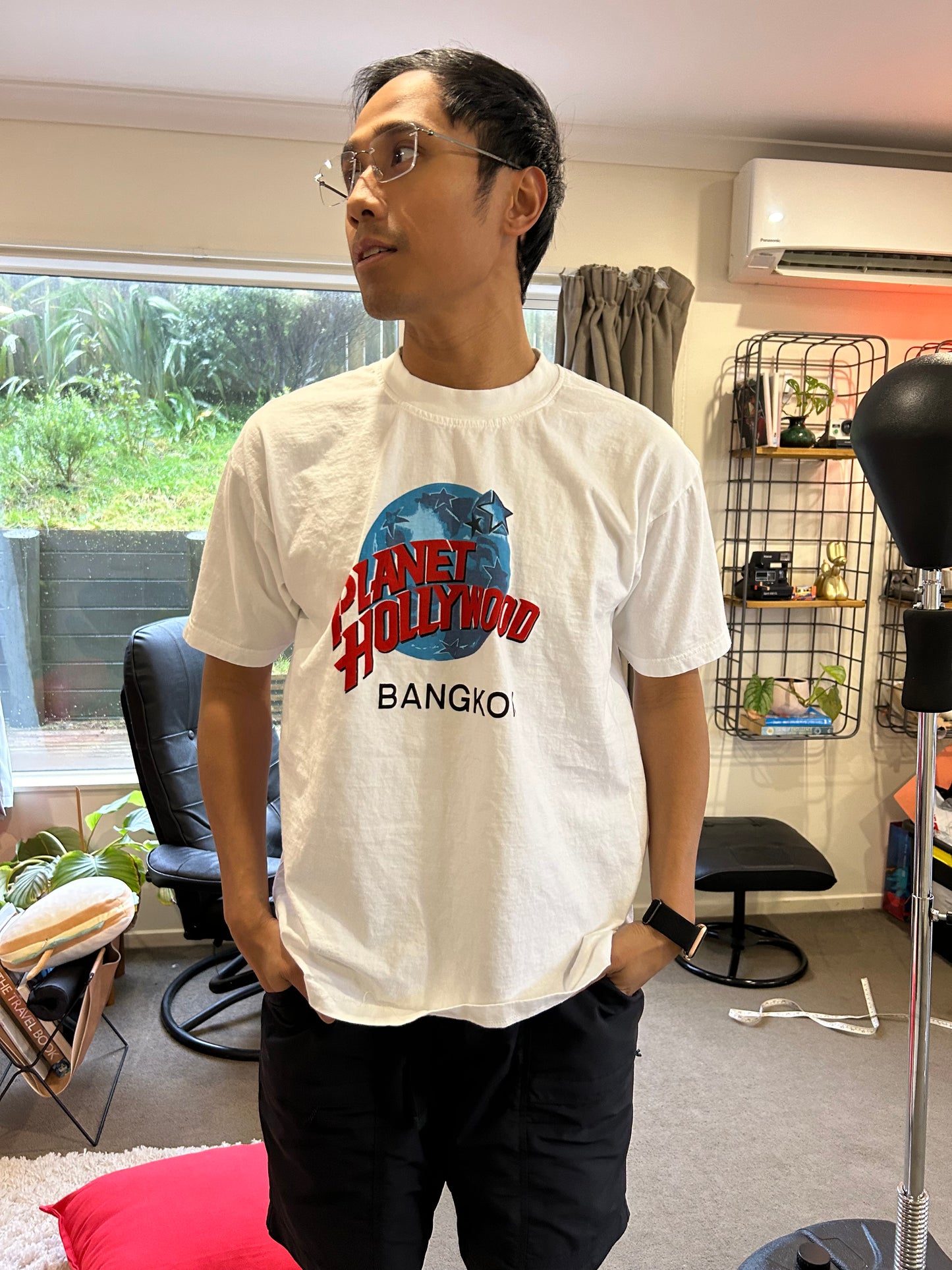 vintage white Planet Hollywood Bangkok t-shirt features the iconic globe logo in blue and red Large White