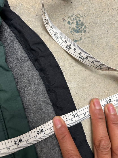 vintage Nautica Competition pullover jacket featuring a green nylon shell with a grey fleece lining and orange accents XL