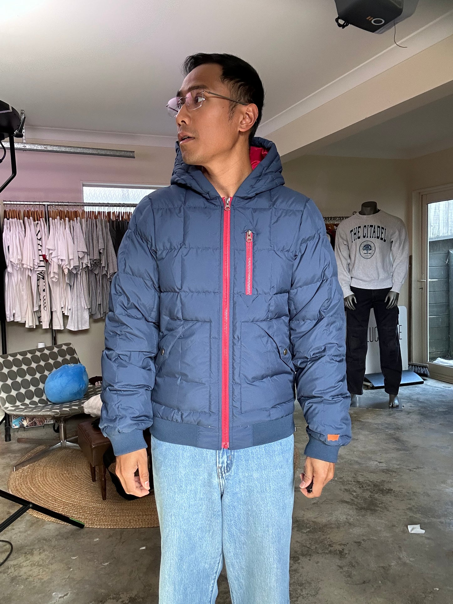 Pertex blue puffer jacket with a red inner lining and red zippers, produced by Levi's Small