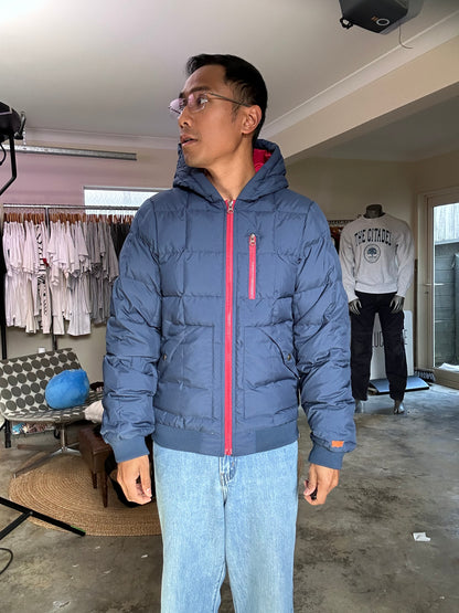 Pertex blue puffer jacket with a red inner lining and red zippers, produced by Levi's Small