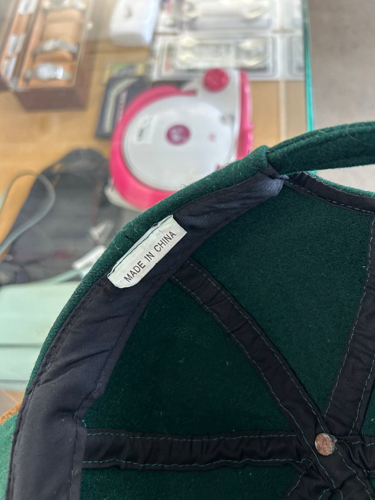 vintage Steinlager two-tone cap featuring a dark green crown and a contrasting tan brim