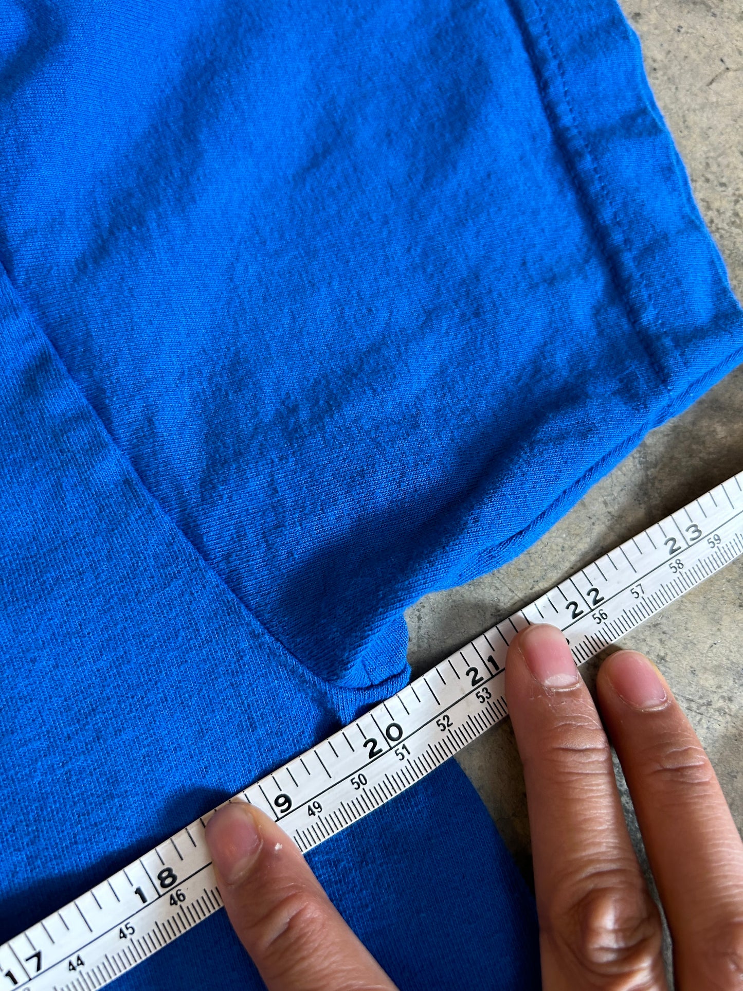 Large blue Sonic the Hedgehog t-shirt features a large graphic of Sonic's face on the front