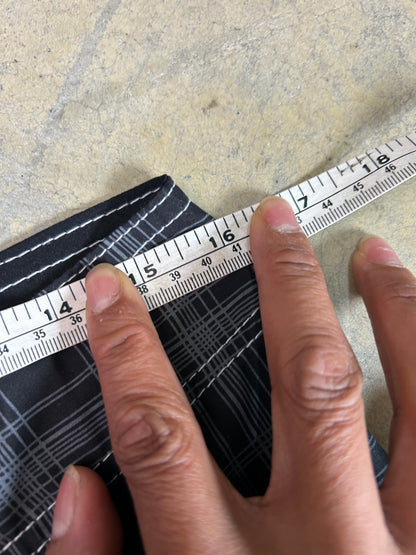2000s Billabong black and grey plaid board shorts featuring a large embroidered logo on the back 32