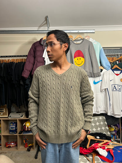 Vintage  Polo Ralph Lauren cable-knit V-neck sweater features a classic olive green textured weave and an embroidered signature pony logo
