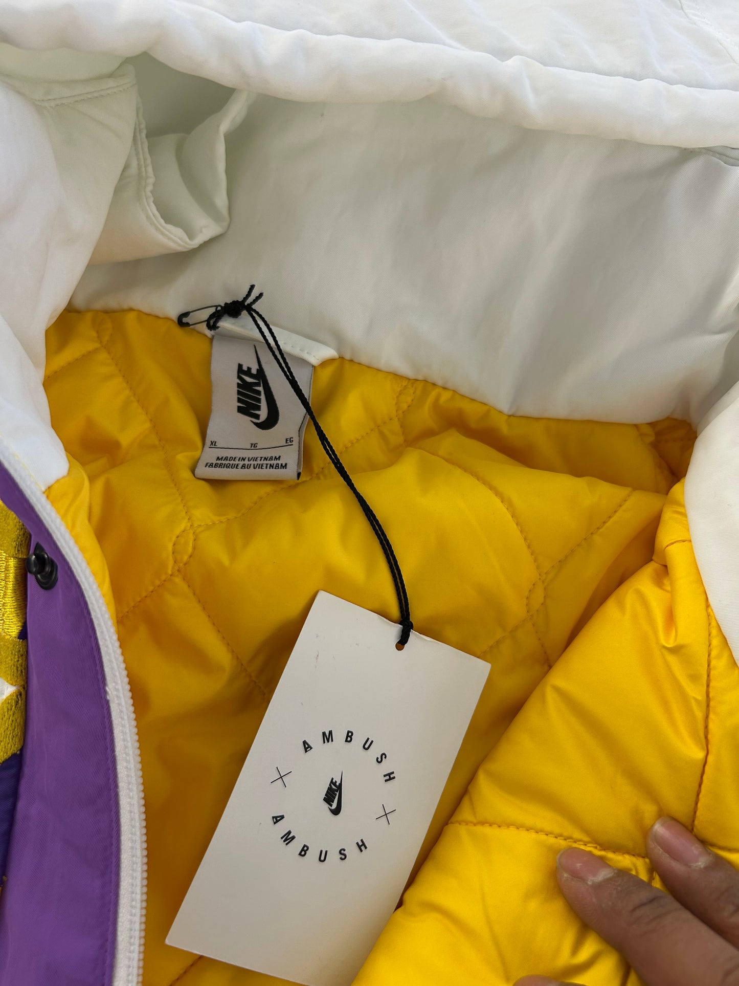 Nike x AMBUSH NBA Collection Los Angeles Lakers Hooded Jacket in summit white featuring bold purple and gold team lettering across the chest XXL
