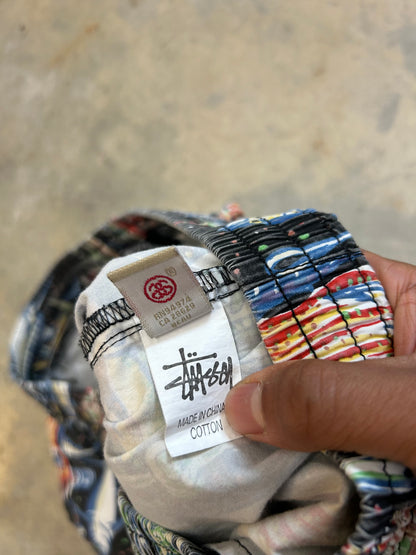 Stüssy beach shorts featuring an all-over fishing-themed graphic print size 34