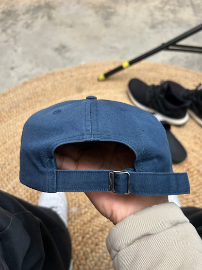 Vintage blue Nike cap featuring an embroidered gold swoosh logo Osfa