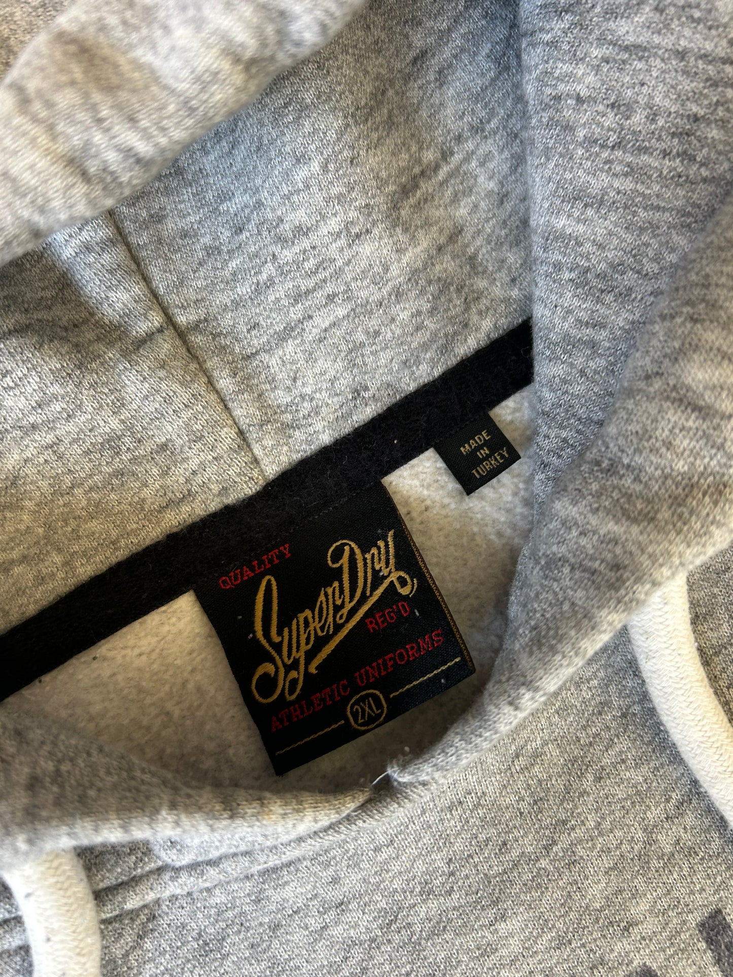 heather grey Superdry Vintage Logo Heritage Hoodie features a distinct cracked graphic print on the chest