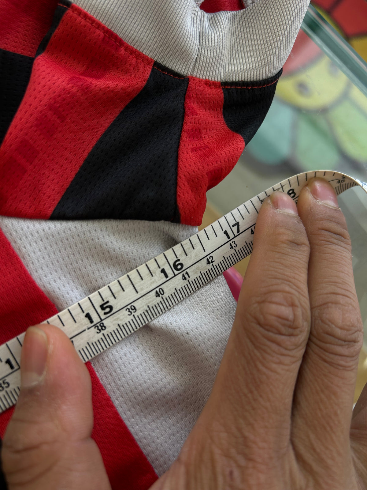 red and black striped Puma AC Milan 2024/25 home jersey featuring the white "Emirates Fly Better" sponsor logo XS