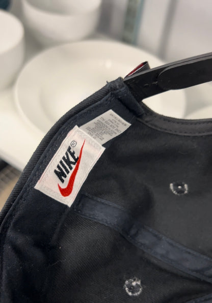 Vintage black Nike baseball cap featuring a white embroidered Swoosh Cotton