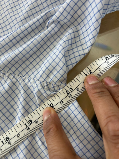 Vintage light blue and white grid-check (graph-check) short-sleeve button-down shirt by Polo Jeans Co. / Ralph Lauren featuring a small dark pony logo embroidered on the chest pocket.