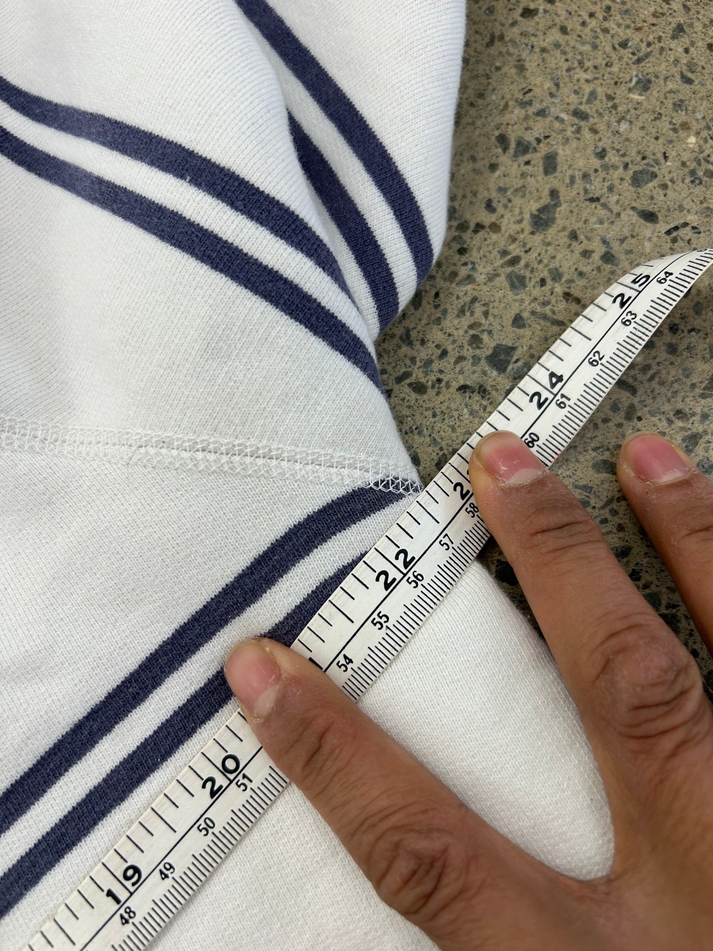 Vintage Polo Ralph Lauren striped crew neck sweater features a white base with navy horizontal stripes and an embroidered crest on the chest.