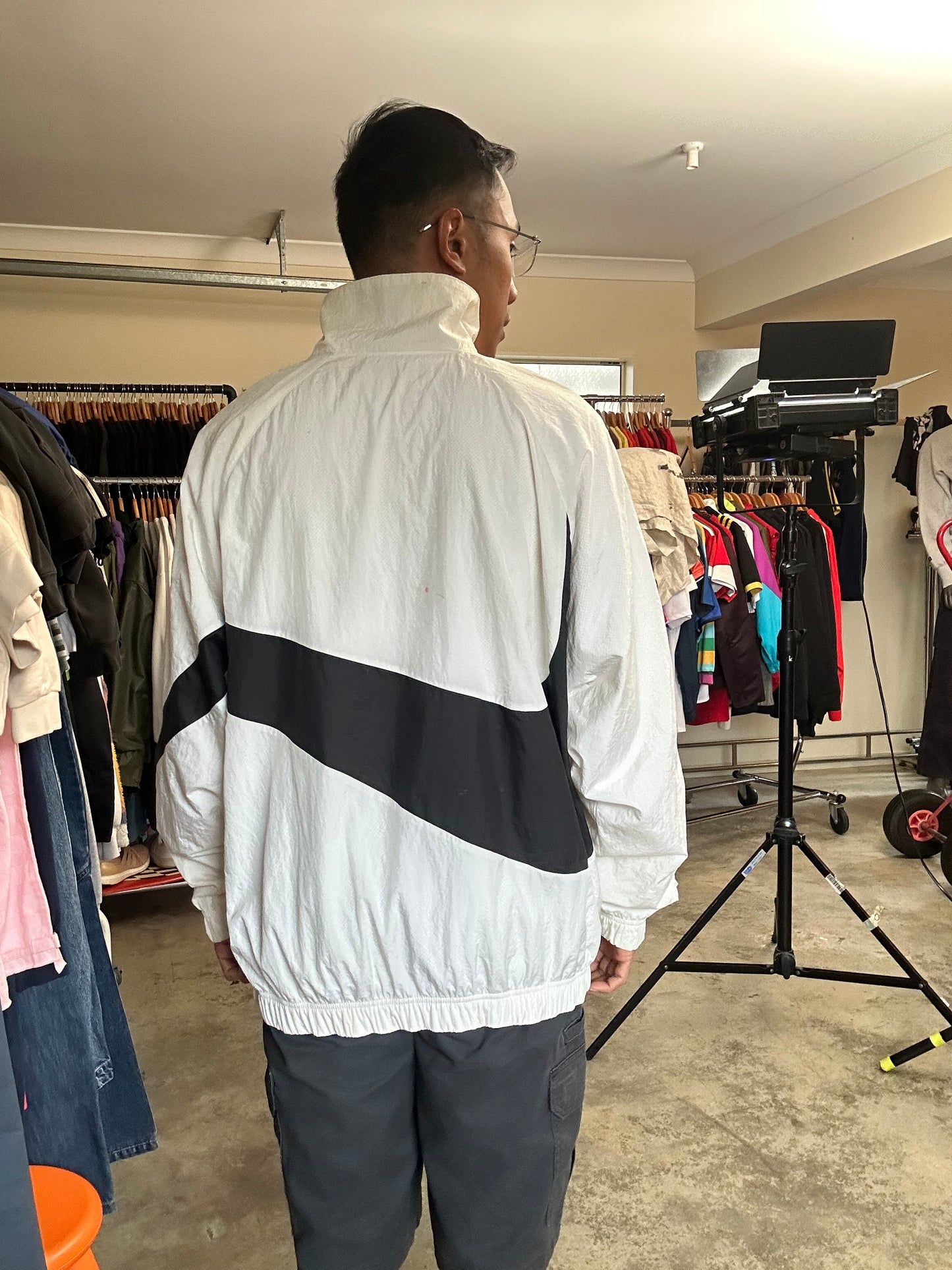 Nike Big Swoosh Woven Statement Jacket, often referred to as a windbreaker, which features a prominent large swoosh design XL White