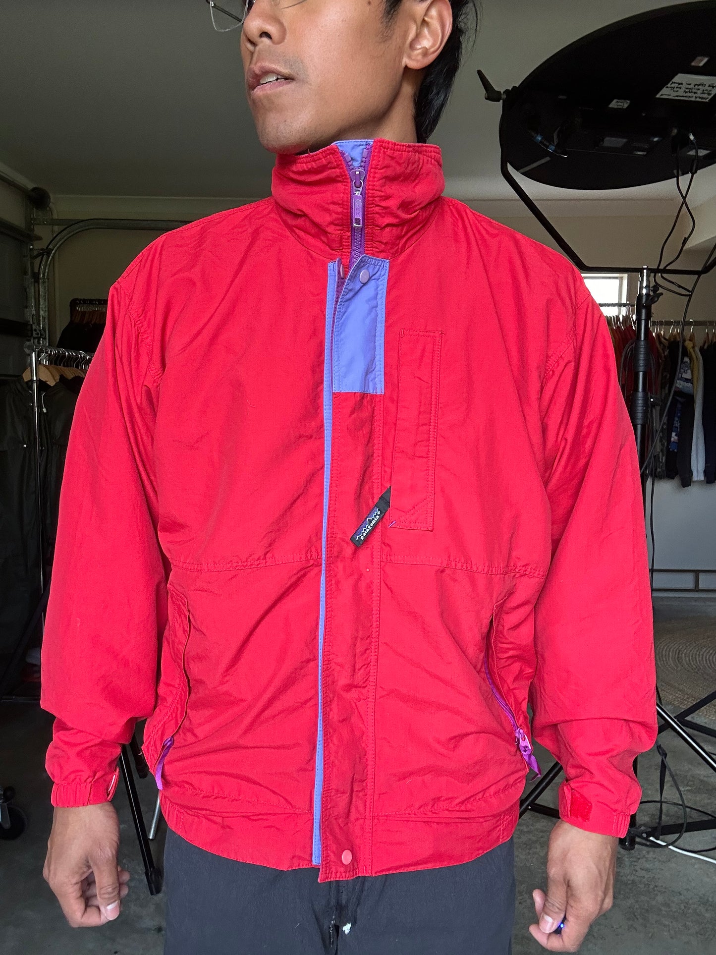 vintage Patagonia jacket, likely from the Fall Line collection, featuring a vibrant red shell and a purple collar Medium