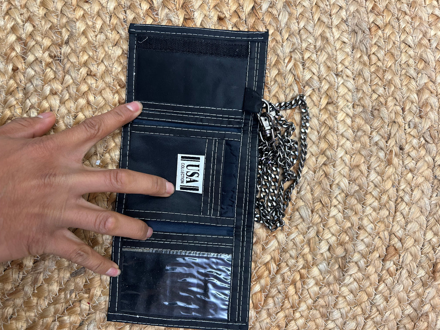 y2k vintage black canvas Nike trifold wallet featuring a red and white embroidered swoosh logo and a silver chain attachment.