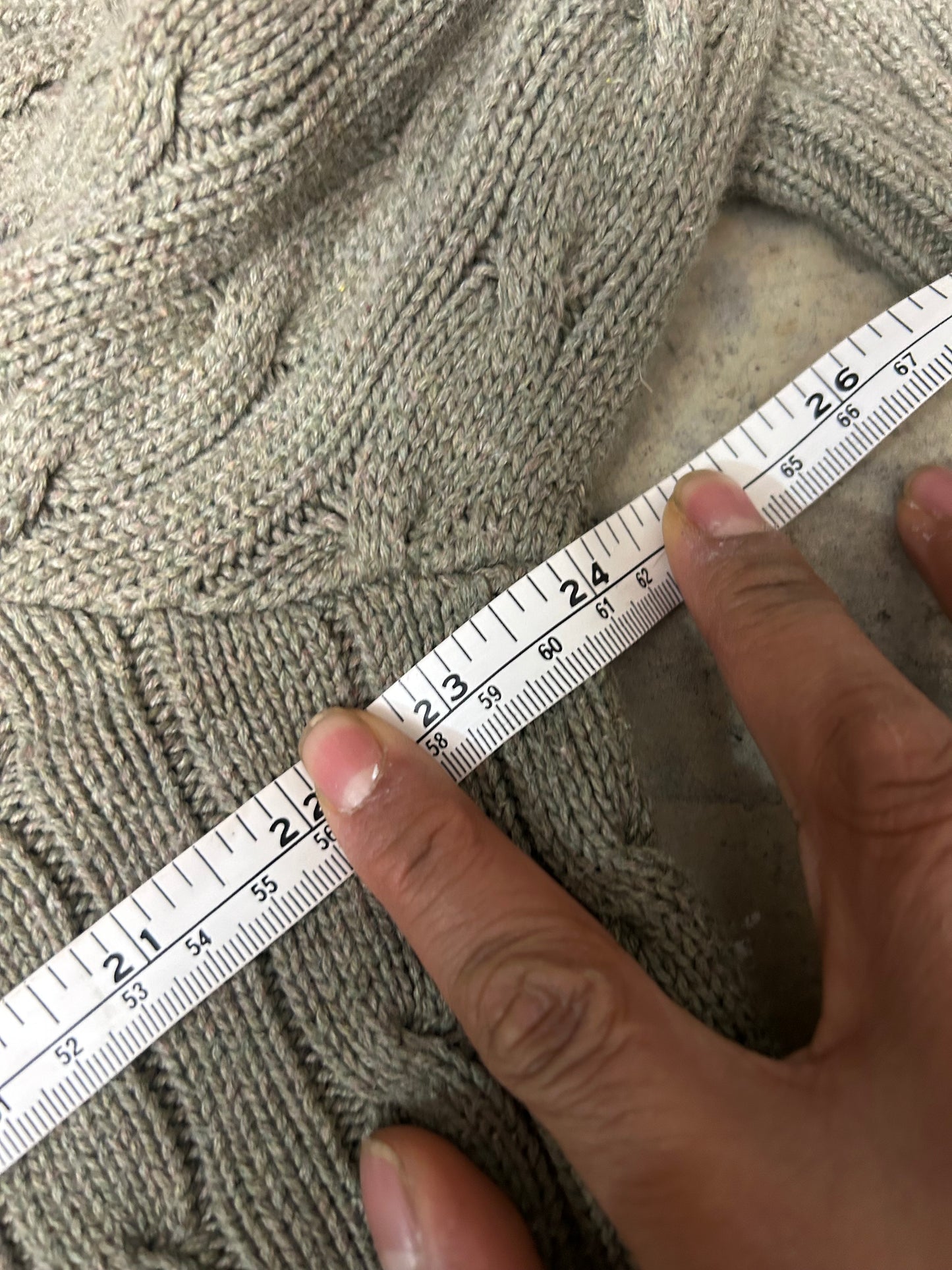 Vintage  Polo Ralph Lauren cable-knit V-neck sweater features a classic olive green textured weave and an embroidered signature pony logo