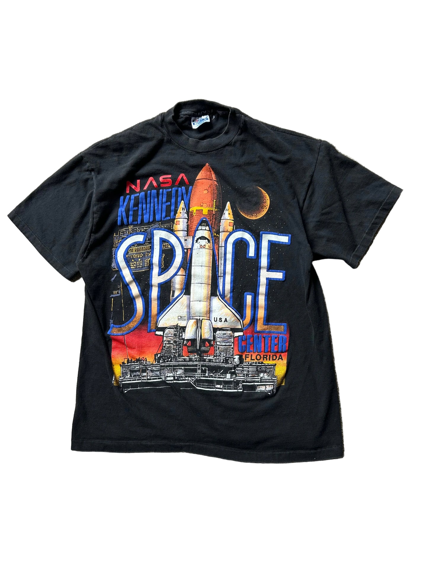 vintage 1990 Hanes Beefy-T t-shirt features a prominent graphic for the NASA Kennedy Space Center in Florida Large Black