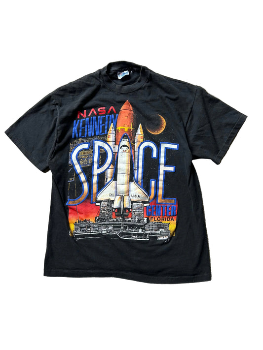 vintage 1990 Hanes Beefy-T t-shirt features a prominent graphic for the NASA Kennedy Space Center in Florida Large Black