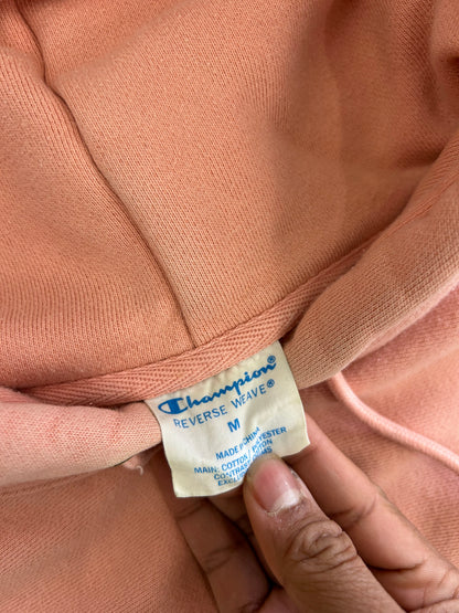 Champion Reverse Weave Small C Hoodie in a light pink or rose shade Medium