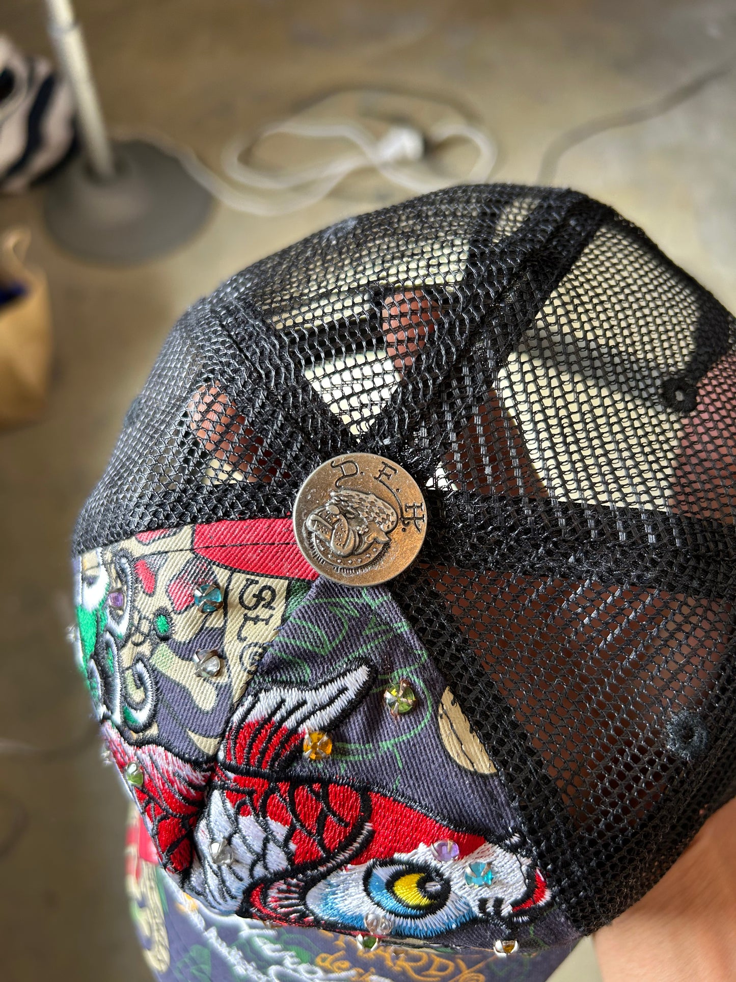 Ed Hardy by Christian Audigier trucker cap, often featuring signature tattoo-inspired graphics and rhinestone
