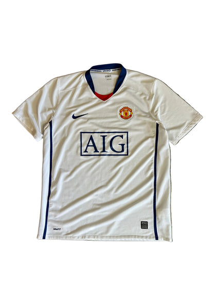 Nike Manchester United away jersey from the 2008-2009 season, featuring a classic white design with a blue V-neck and "AIG Large White