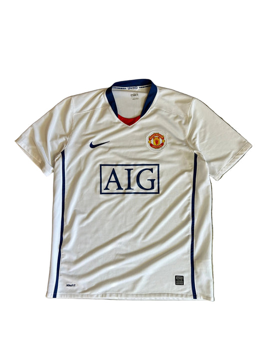 Nike Manchester United away jersey from the 2008-2009 season, featuring a classic white design with a blue V-neck and "AIG Large White