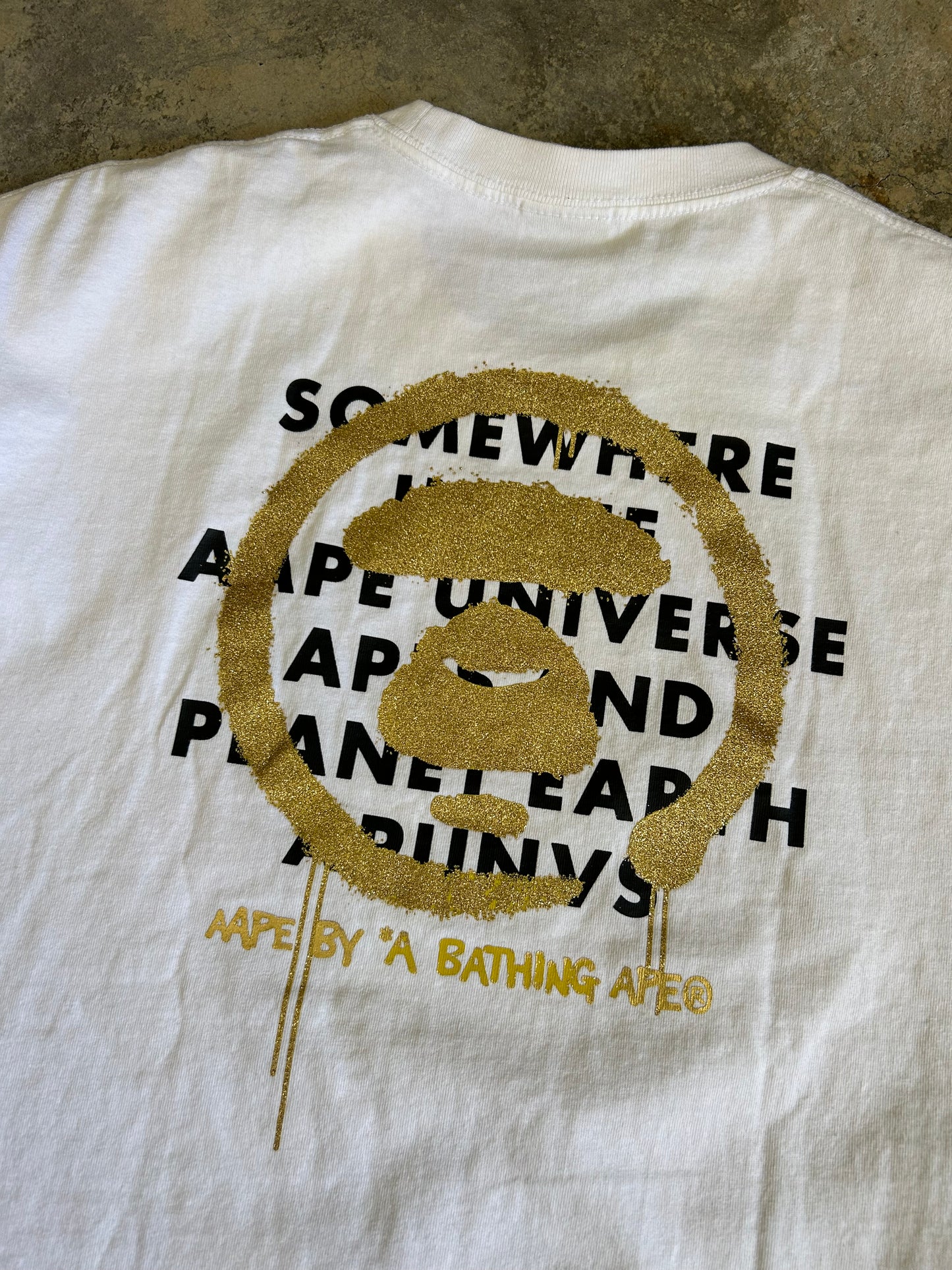 white t-shirt is the AAPE by A Bathing Ape logo-print T-shirt Small