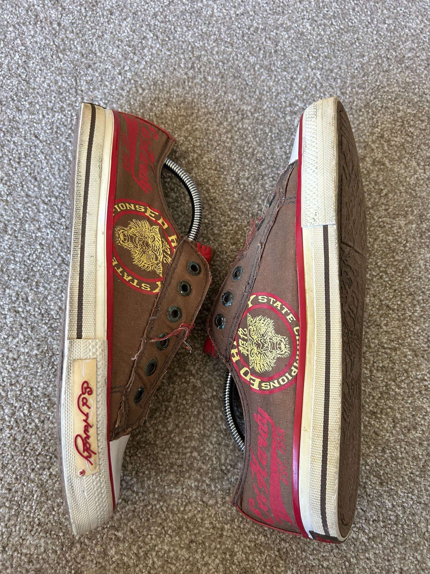 Ed Hardy slip-on canvas sneakers in brown and red with graphic prints.l Brown size US 10 EU 44