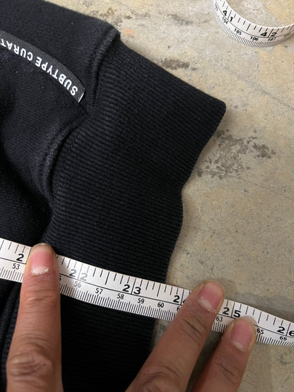 black Subtype Curated hoodie features a prominent kangaroo pocket and a clean, minimalist design Small