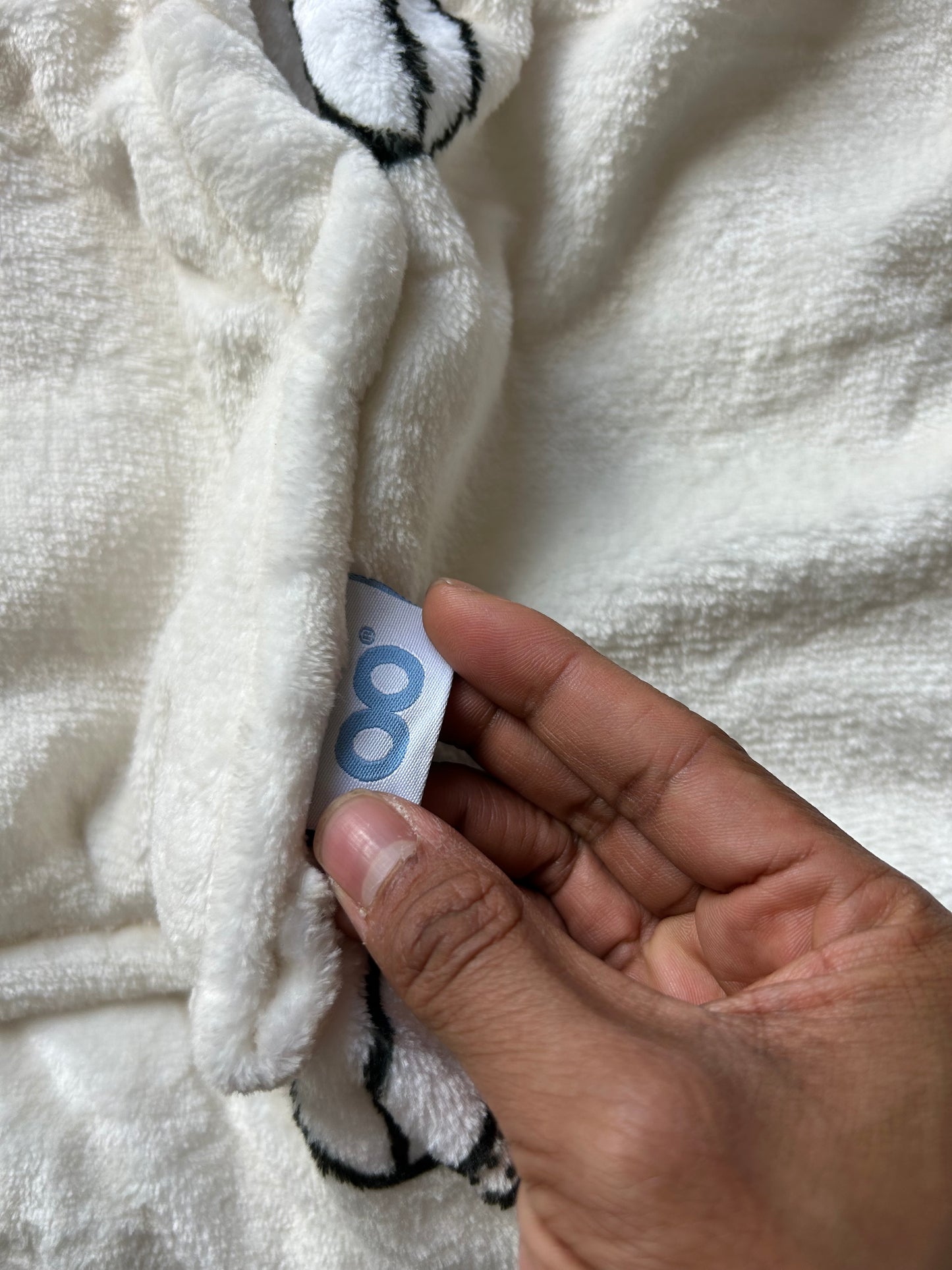 Jed's branded wearable blanket hoodie, "Oodie Cream