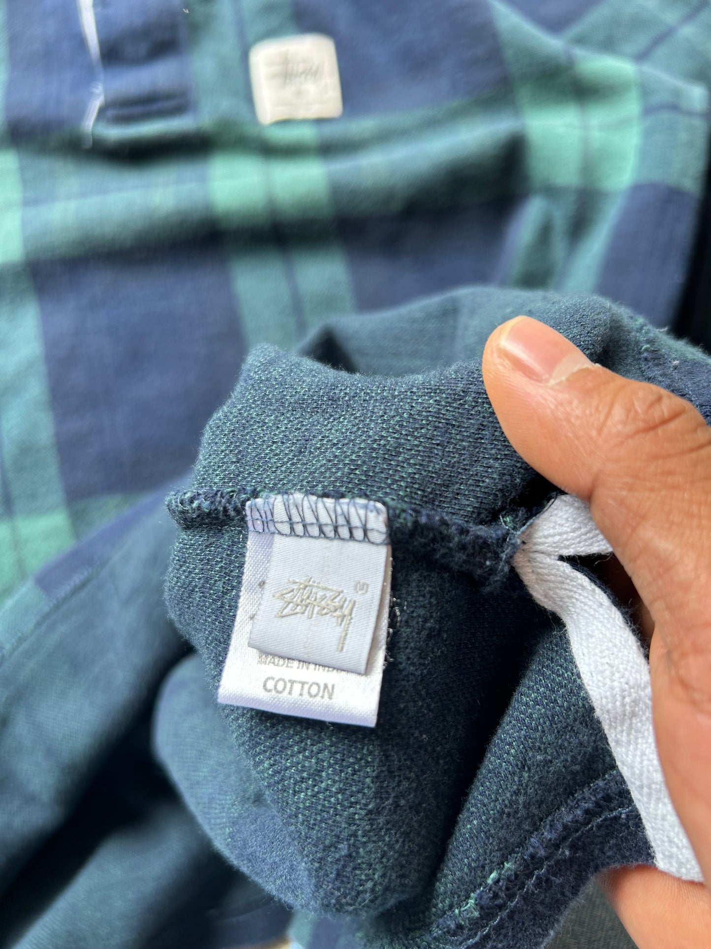 green and navy plaid shirt is the Stussy June Jacquard Rugby Shirt XL