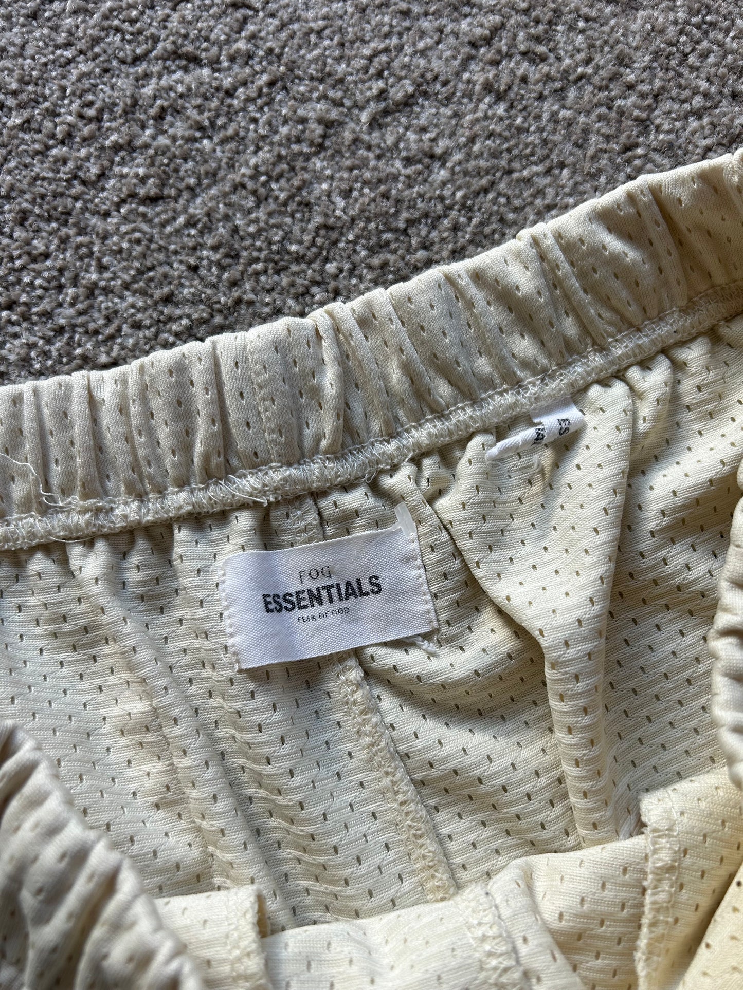 Fear of God Essentials Graphic Mesh Drawstring Shorts
Cream Medium