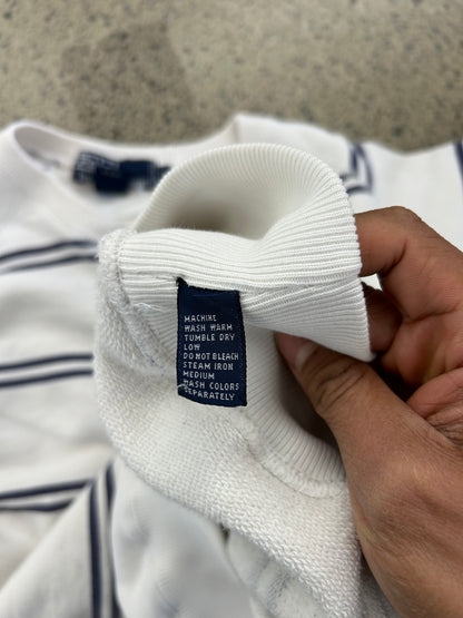 Vintage Polo Ralph Lauren striped crew neck sweater features a white base with navy horizontal stripes and an embroidered crest on the chest.